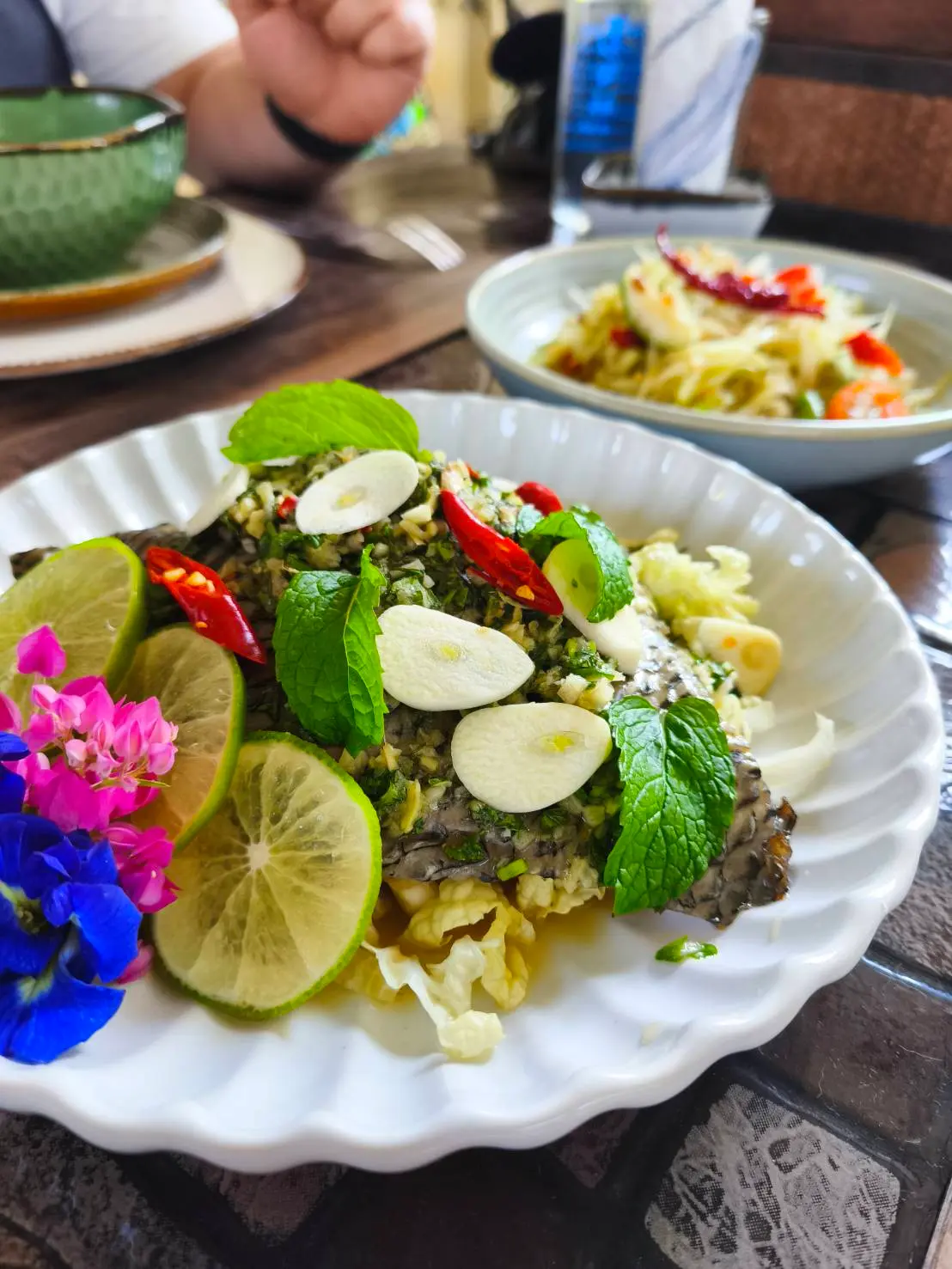 Cooking class students learning Thai cuisine at Trichada The Cookery Home
